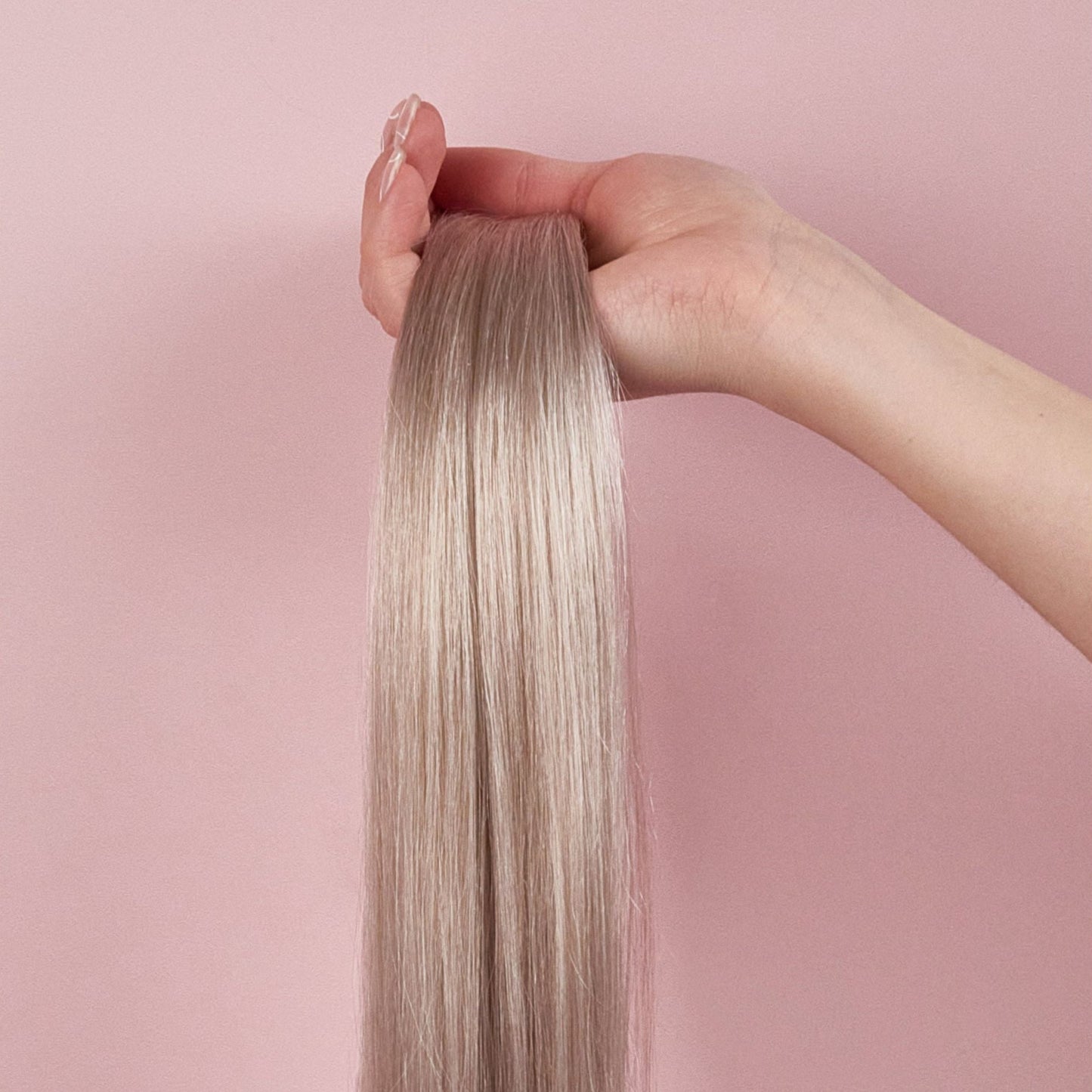 clip in human hair extensions seamless luxe silver in hand