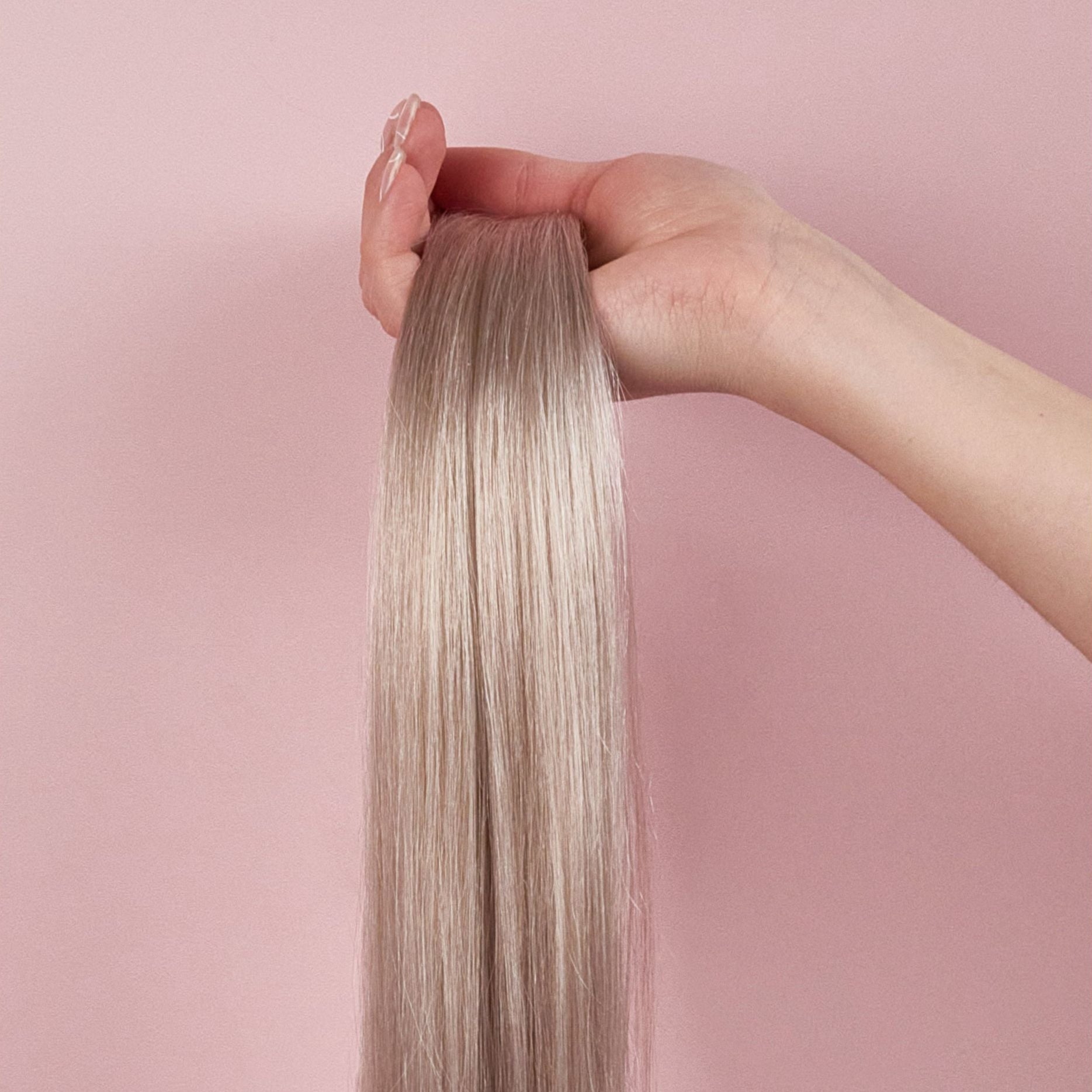 clip in human hair extensions seamless luxe silver in hand
